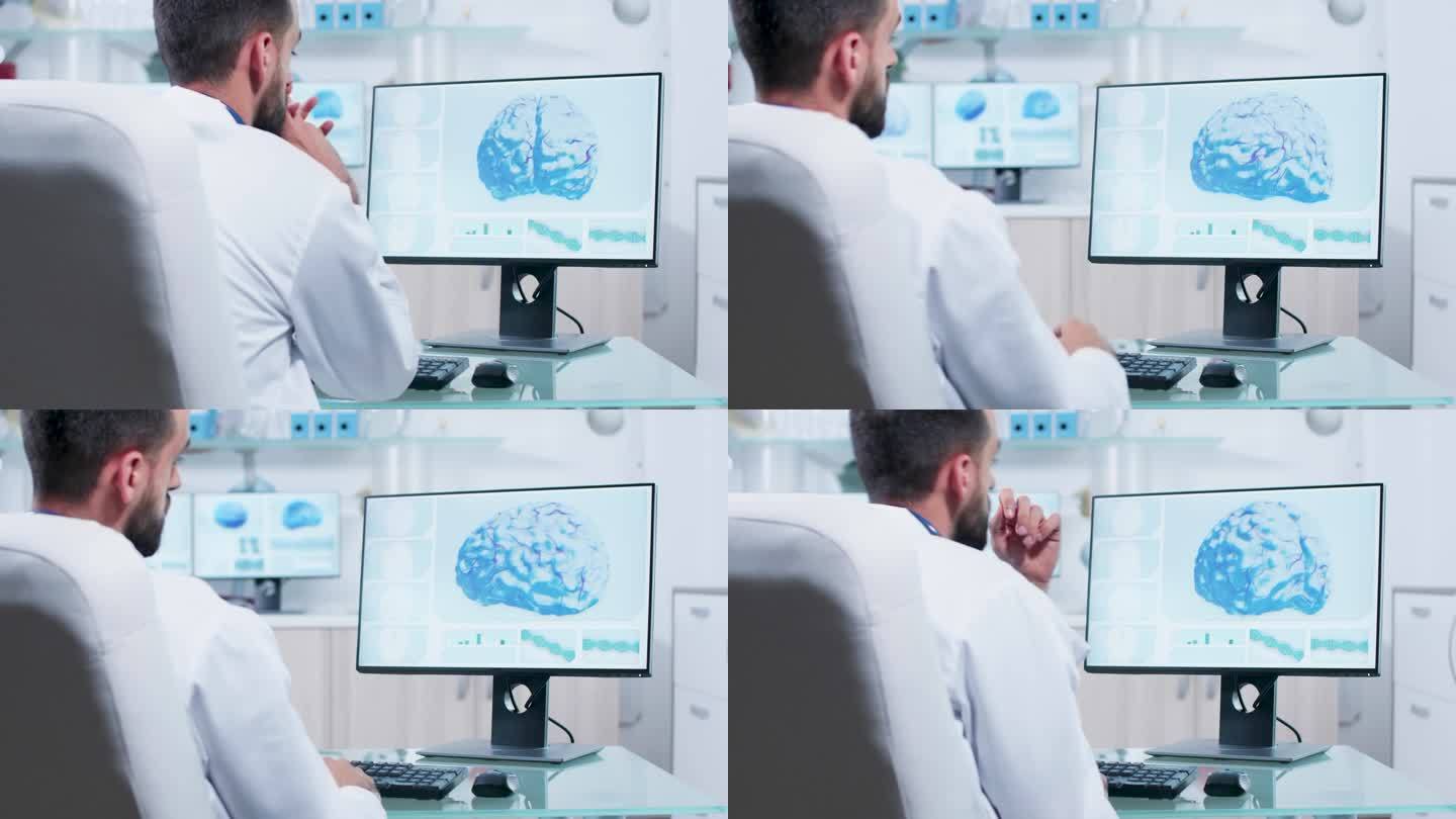 医生在显示器上观察3D脑部扫描