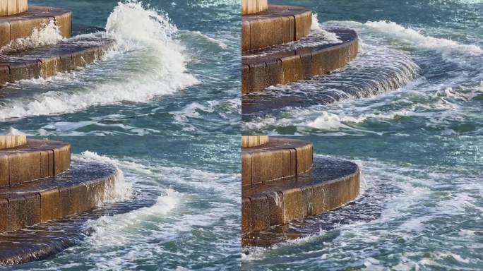 海水涨潮海浪拍打在岩石上