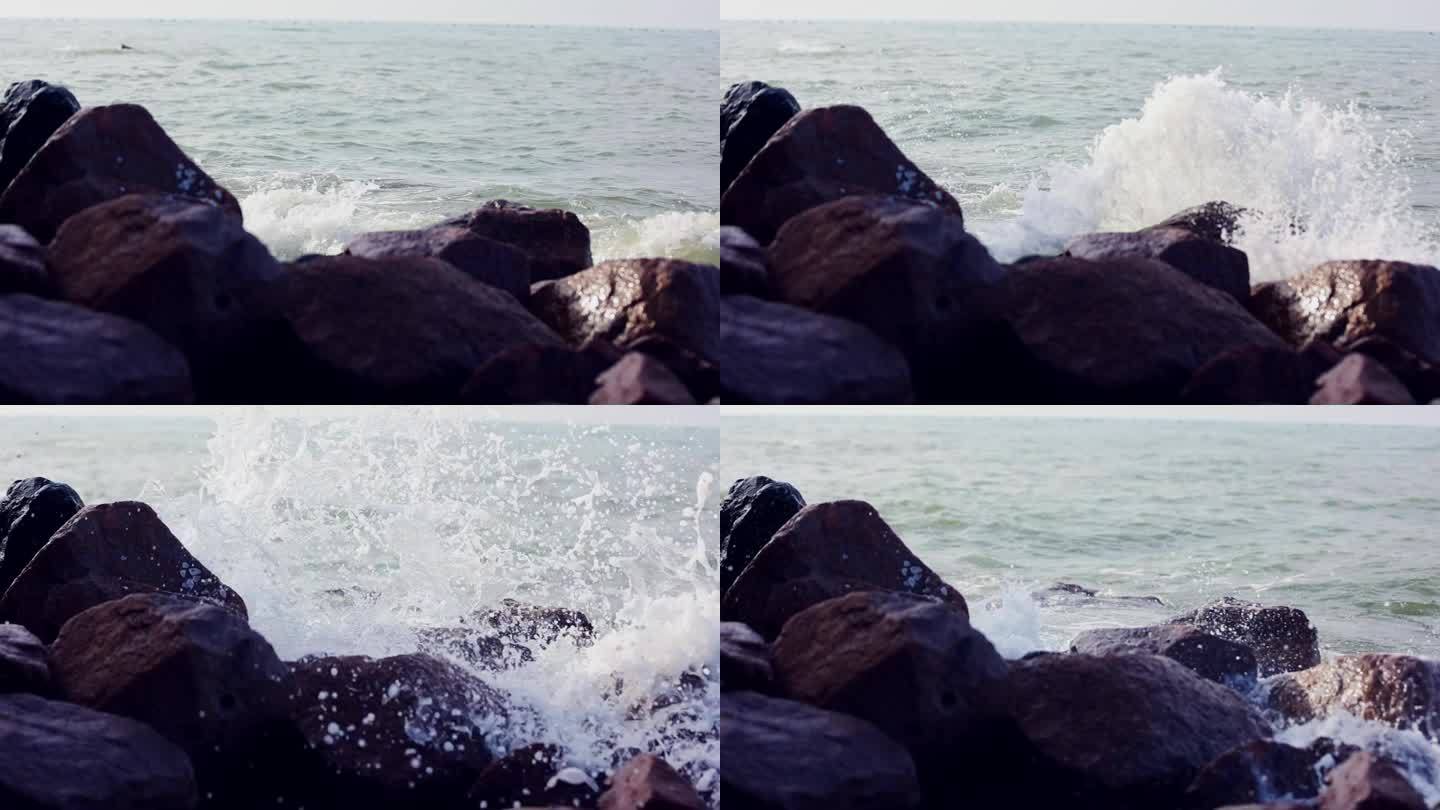 海水涨潮海浪拍打在岩石上