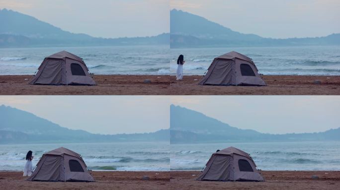 在海边沙滩上搭帐篷露营