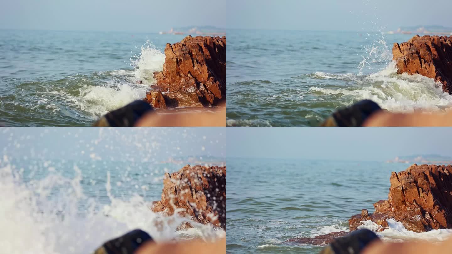 海水涨潮海浪拍打在岩石上