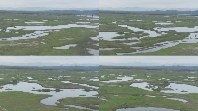 高铁窗外风景远山低洼沼泽湿地