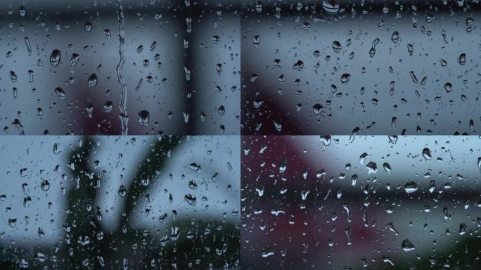 雨水玻璃窗外的雨下雨天窗户玻璃雨滴水珠