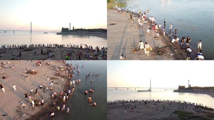 炎热夏季长江边沙滩戏水玩耍