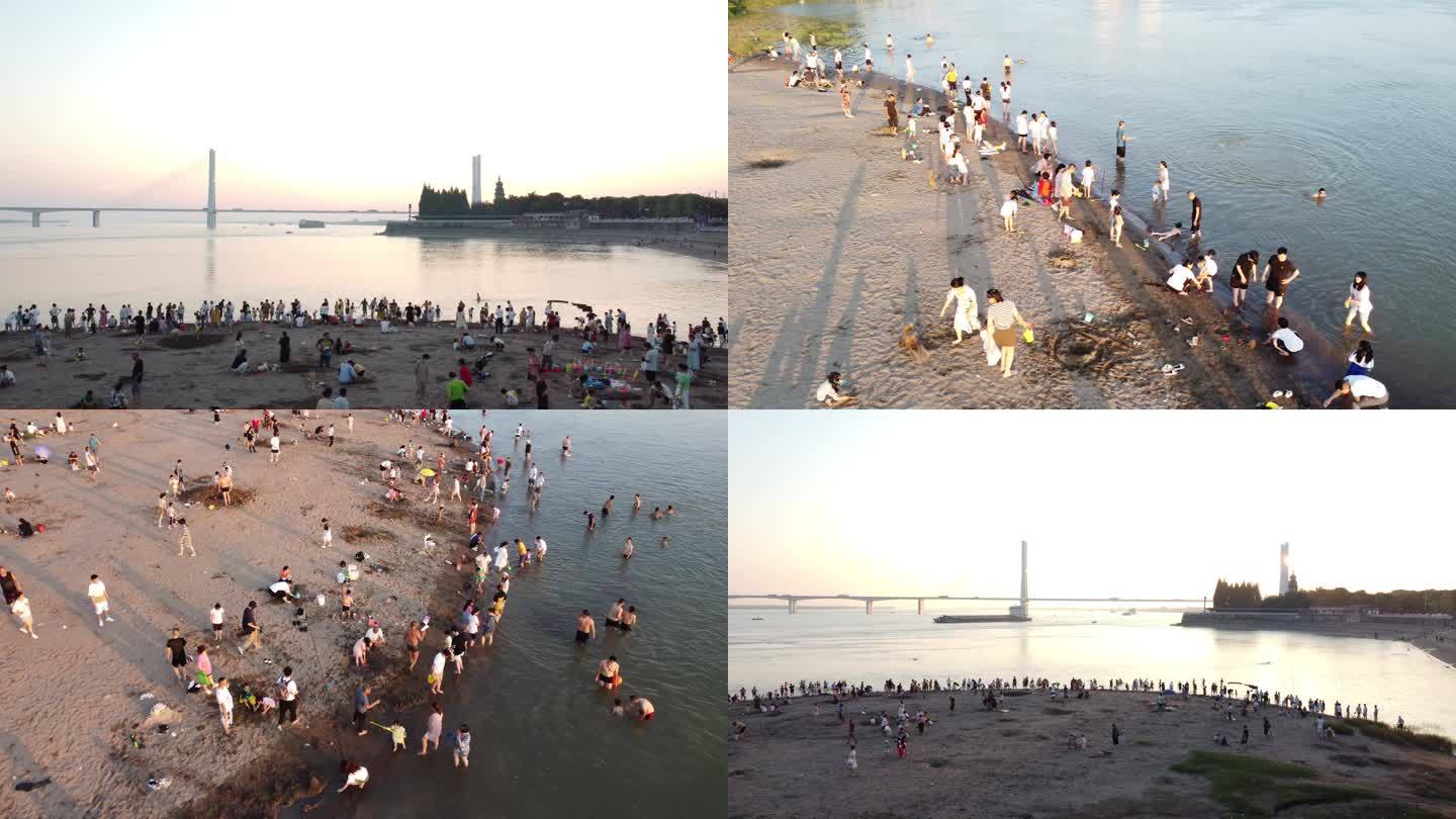炎热夏季长江边沙滩戏水玩耍