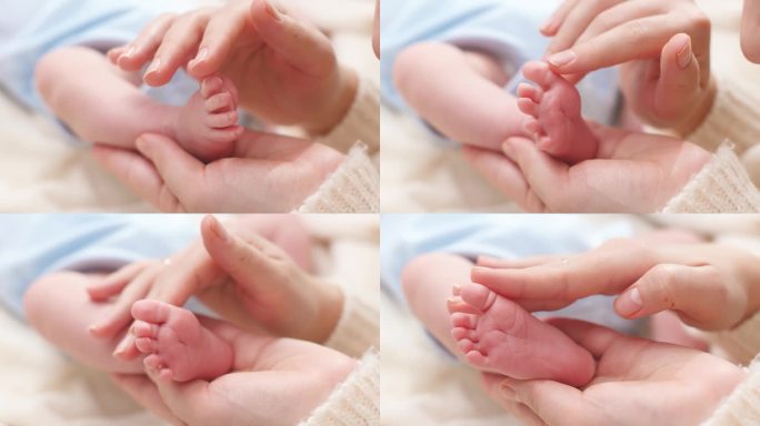 婴儿的小脚在温柔的母亲手里拍了下来。家庭幸福和有年幼子女的慈爱父母的概念