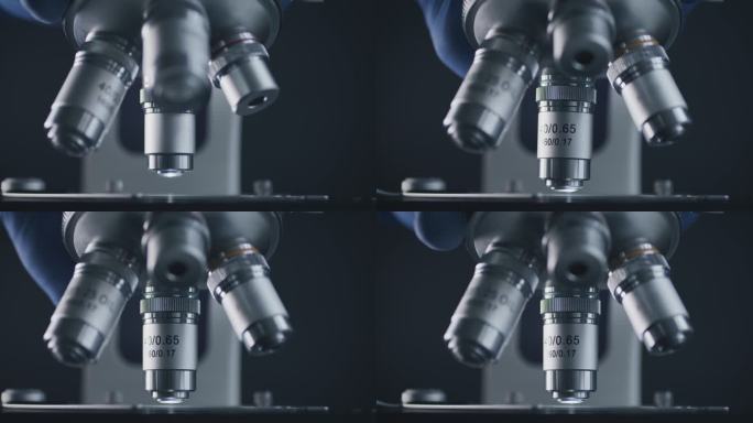 实验室用金属透镜进行样品滑行和显微镜观察。