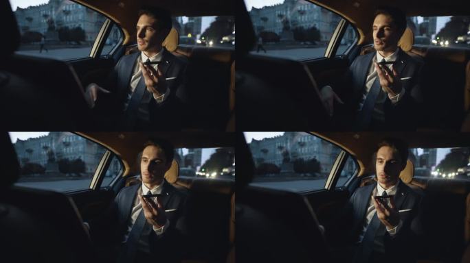 让男性专业人员在黑暗车里的手机上记录语音讯息。