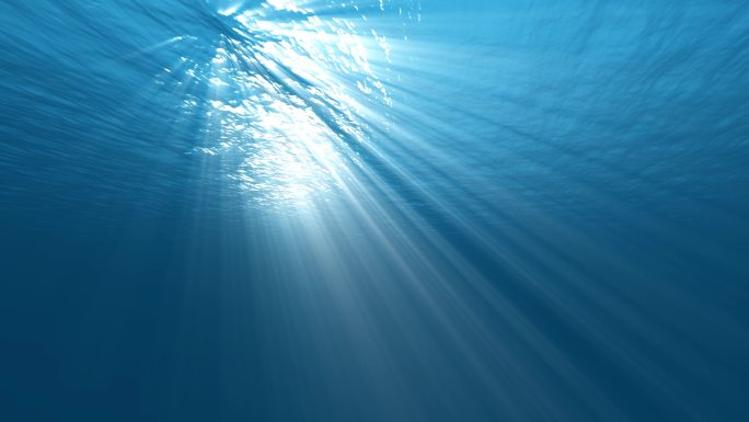 水下光线穿过蓝色海面 阳光洒落海底