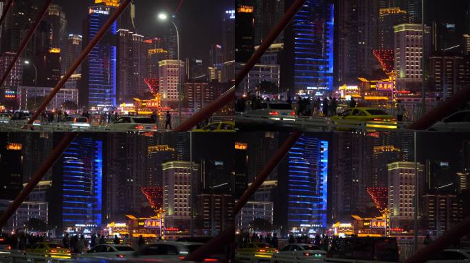 游客站在千厮门嘉陵江大桥看重庆洪崖洞夜景