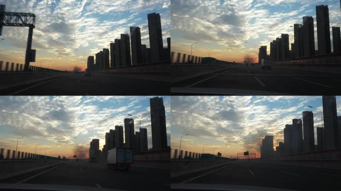 车辆行驶在高速公路上满天云彩与霞光