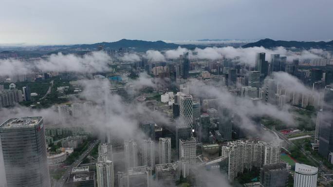 南山区城市上空低空云层航拍4k视频