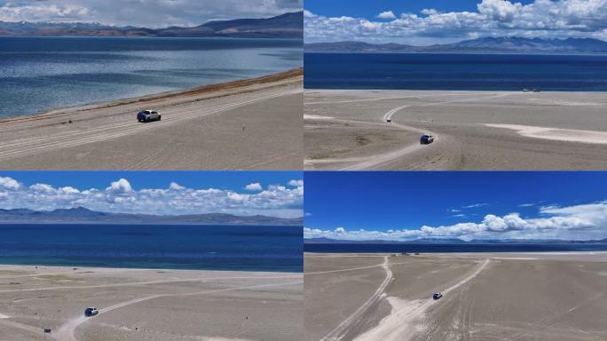 西藏湖边汽车行驶驾驶开车道路自驾游在路上
