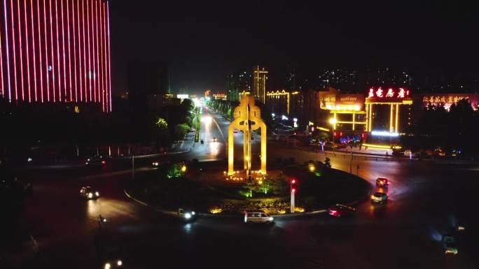 航拍辉县环岛交通共字转盘夜景前推标志建筑