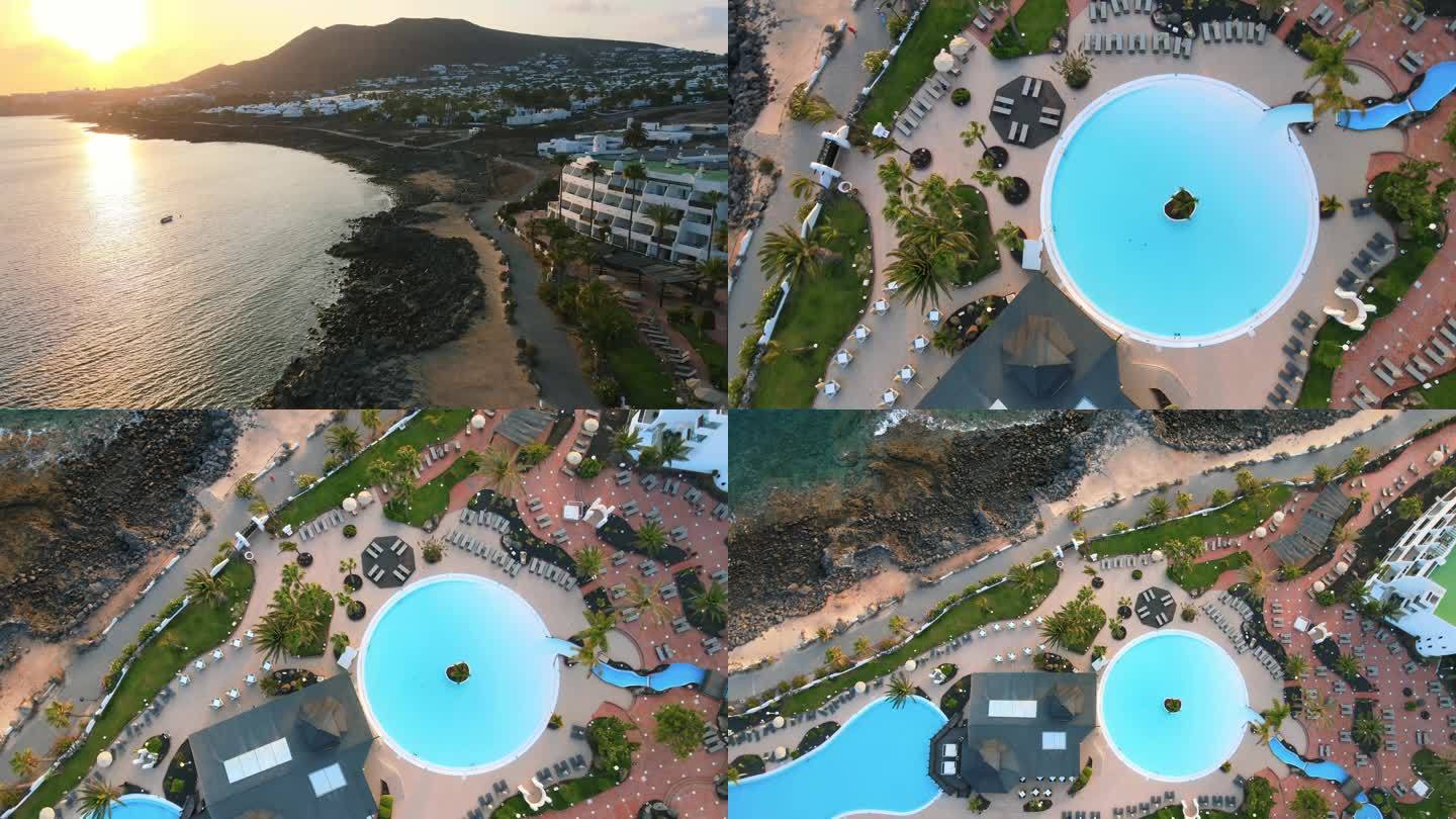 无人机航拍海边度假酒店度假村海浪海岛日落
