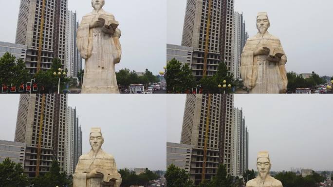 航拍辉县环岛交通高清素材 上升李时珍雕像