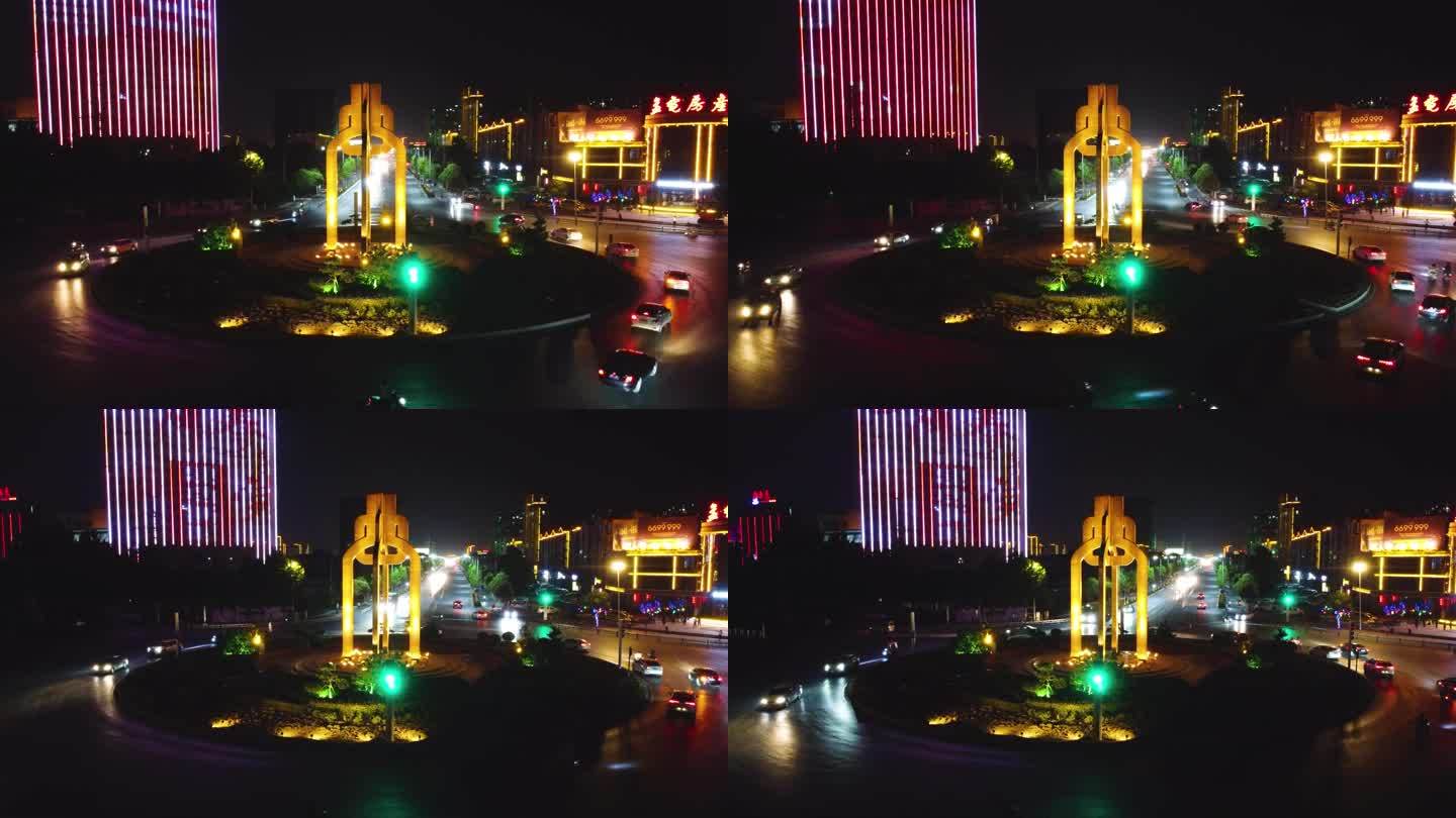 航拍辉县环岛交通共字转盘夜景环绕标志建筑