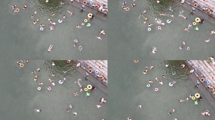 夏天暑假孩子学生野外江河里游泳玩水安全