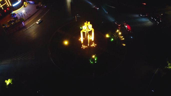 航拍辉县环岛交通共字转盘夜景环绕升高拉远