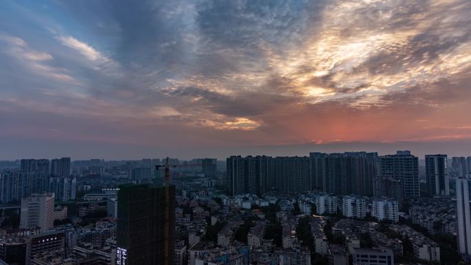 城市日落晚霞彩霞日转夜亮灯万家灯火延时