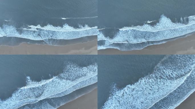 俯拍沙滩潮汐海水浪花拍打海岸海边涨潮退潮