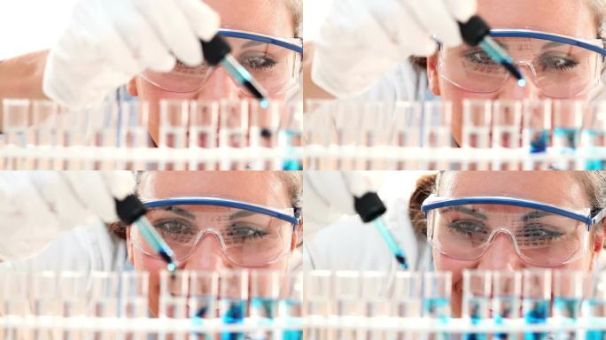 可爱医学或科学研究员-化学家-科学家在实验室中使用吸管和试管