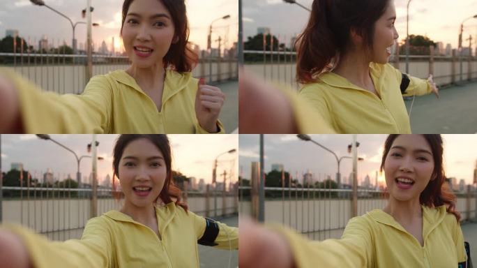 有魅力的年轻亚洲运动员在城市锻炼的同时，通过社交媒体在网上直播视频，影响了节目主持人女士。早上穿运动