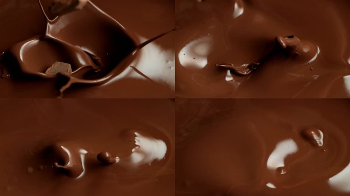 飞溅成融化巧克力的生巧克力片的超级慢动作.