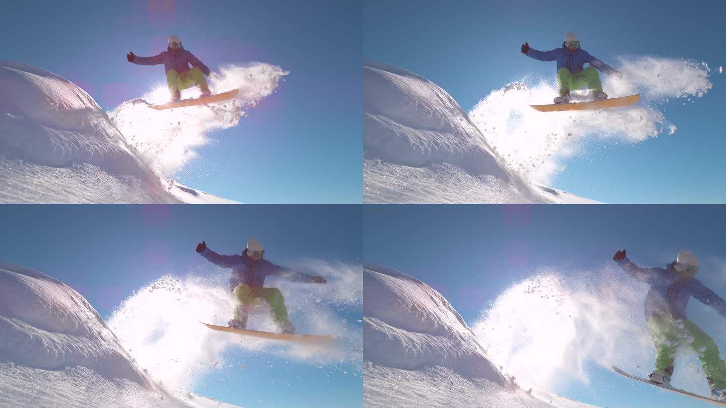 慢动作：鼓励滑雪者在新雪中跳跃，在阳光下喷射雪花