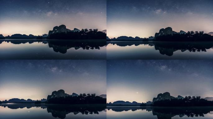 密尔基韦和星星在夜间对大坝水的反射 