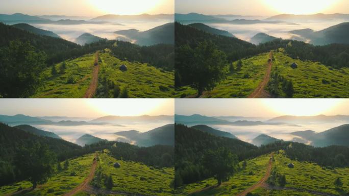 山中的晨景。在土路上飞奔，在日出时分，山谷中笼罩着美丽的雾气.