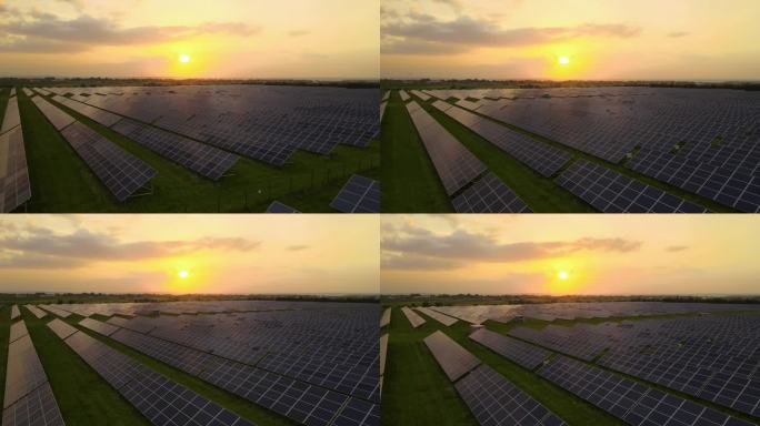 大型可持续发电厂的鸟瞰图，带有成排的太阳能光伏板，用于在晚上产生清洁的电能。零排放可再生电力的概念