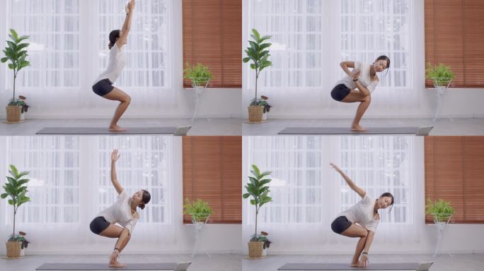 站在Parsvakonasana的姿态，侧角运动，亚洲女士做瑜伽，漂亮的女性穿着灰色运动服，在家里锻