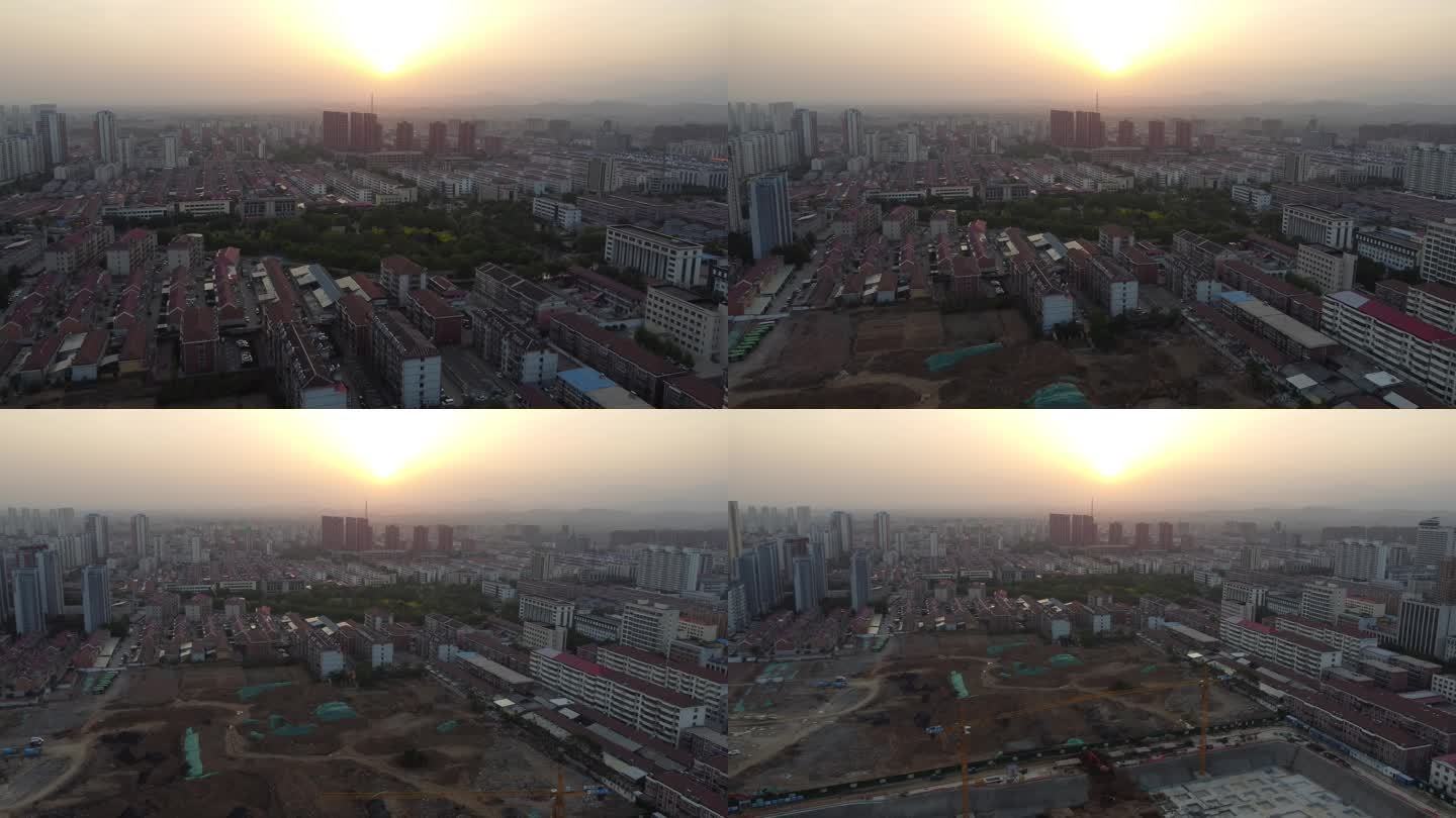 夕阳下城市大面积建筑工地施工场景