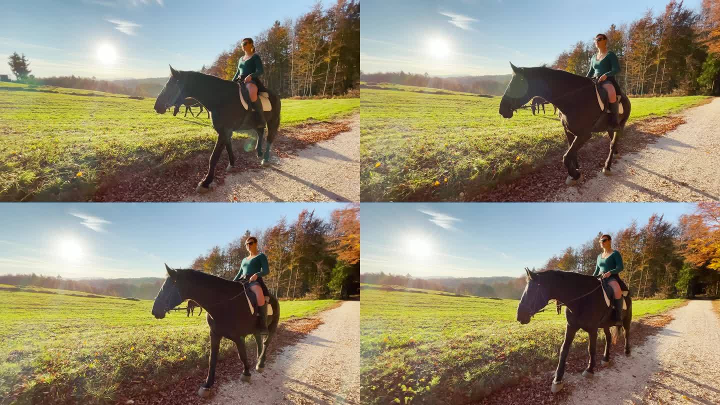 丽恩 · 弗拉尔：快乐的骑马者探索美丽的秋天的彩色乡村