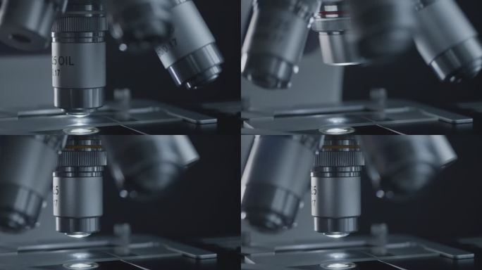 实验室用金属透镜进行样品滑行和显微镜观察。