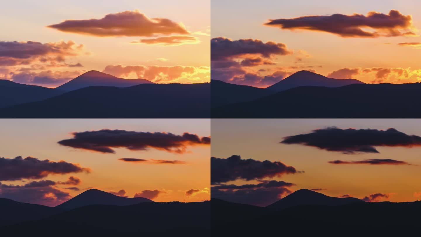 美丽的黄昏全景，夕阳西下，夕阳西下，远山峰顶，夕阳西下