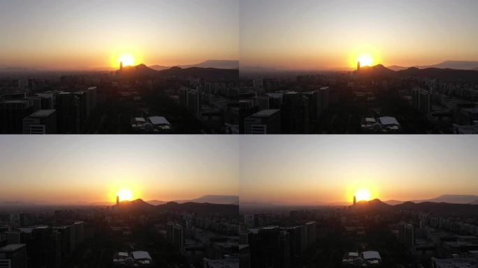 圣地亚哥城市天际线在日落。鸟瞰图。拉斯孔德斯公社。智利。无人机侧向飞行