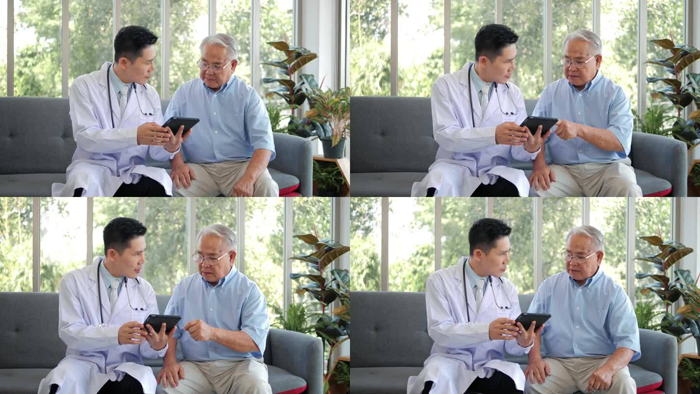 亚洲男性专业医生在家里坐在沙发上，用数字平板应用软件访问老年患者，解释处方，并给出了医学测试结果。老