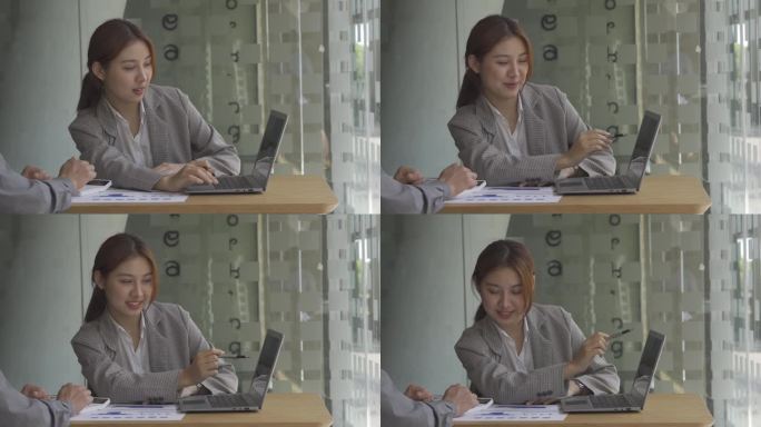 在办公室里从事财务会计工作的亚洲妇女，在商业概念表的计算分析中使用笔记本电脑和图形化文档.