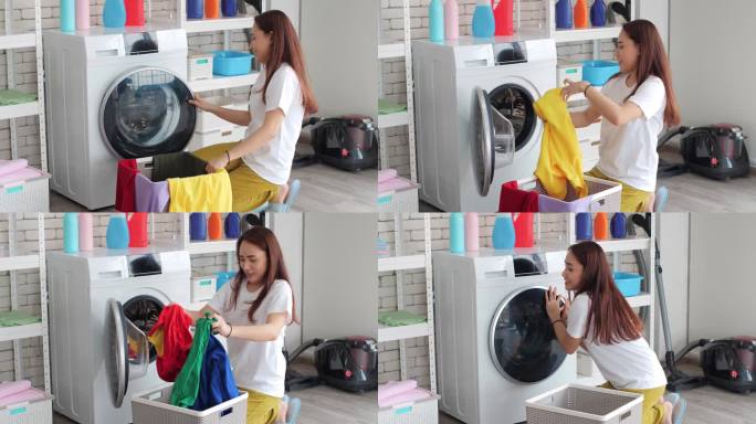 穿着家常衣服的亚洲年轻女子坐在洗衣机前。她给洗衣机装上脏衣服。