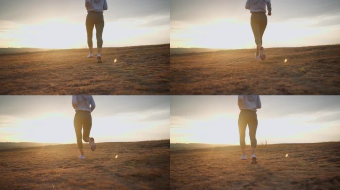 夏天日落时在乡村田野上奔跑的坚强女人的特写镜头。健康运动生活方式理念
