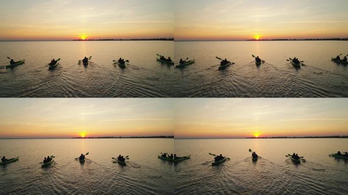 五艘皮划艇与游客的鸟瞰图。他们航行去迎接日出。极端的水上旅行。
