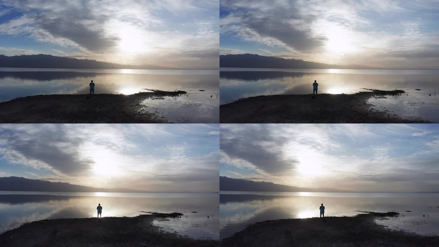 一个人站在湖边看风景