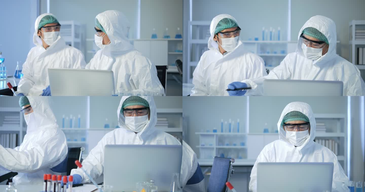 亚洲男性医生、科学家在实验室撰写分析结果。年轻科学家在做一些研究。他在现代实验室做实验。