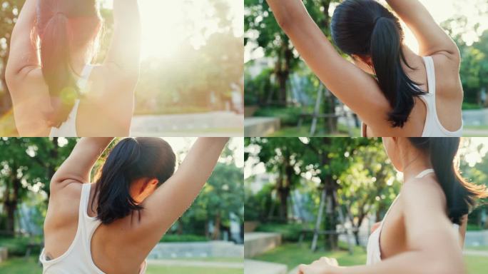 年轻美丽的亚洲女运动员在黄昏时在城市公园里跑步后，伸展身体热身。户外运动和健身健康的生活方式概念.近