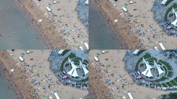航拍威海国际海水浴场大白帆广场沙滩游客