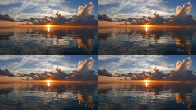 一个非常丰富多彩的日出视频从杜马格特城市海岸与镜子一样的海洋。太阳可以在地平线上看到。用缓慢的平移相