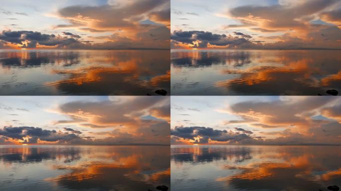 一个平静, 非常丰富多彩的日出视频从杜马格特城市海岸与明镜般的海洋。用缓慢的平移相机拍摄.