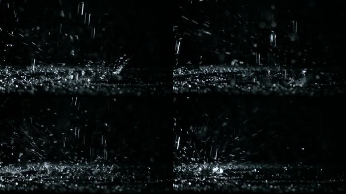用高速摄影机慢动作拍摄黑色背景的水壶上的沸水